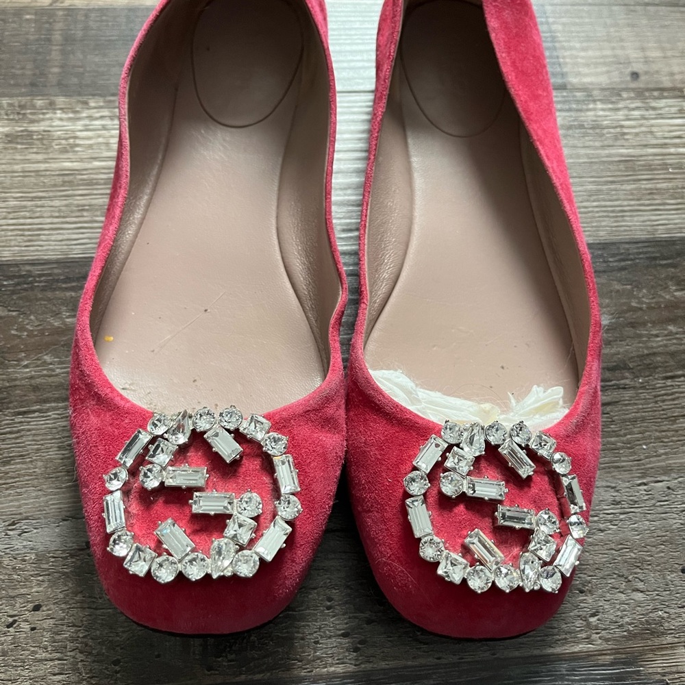 Pink suede Gucci ballet flats.